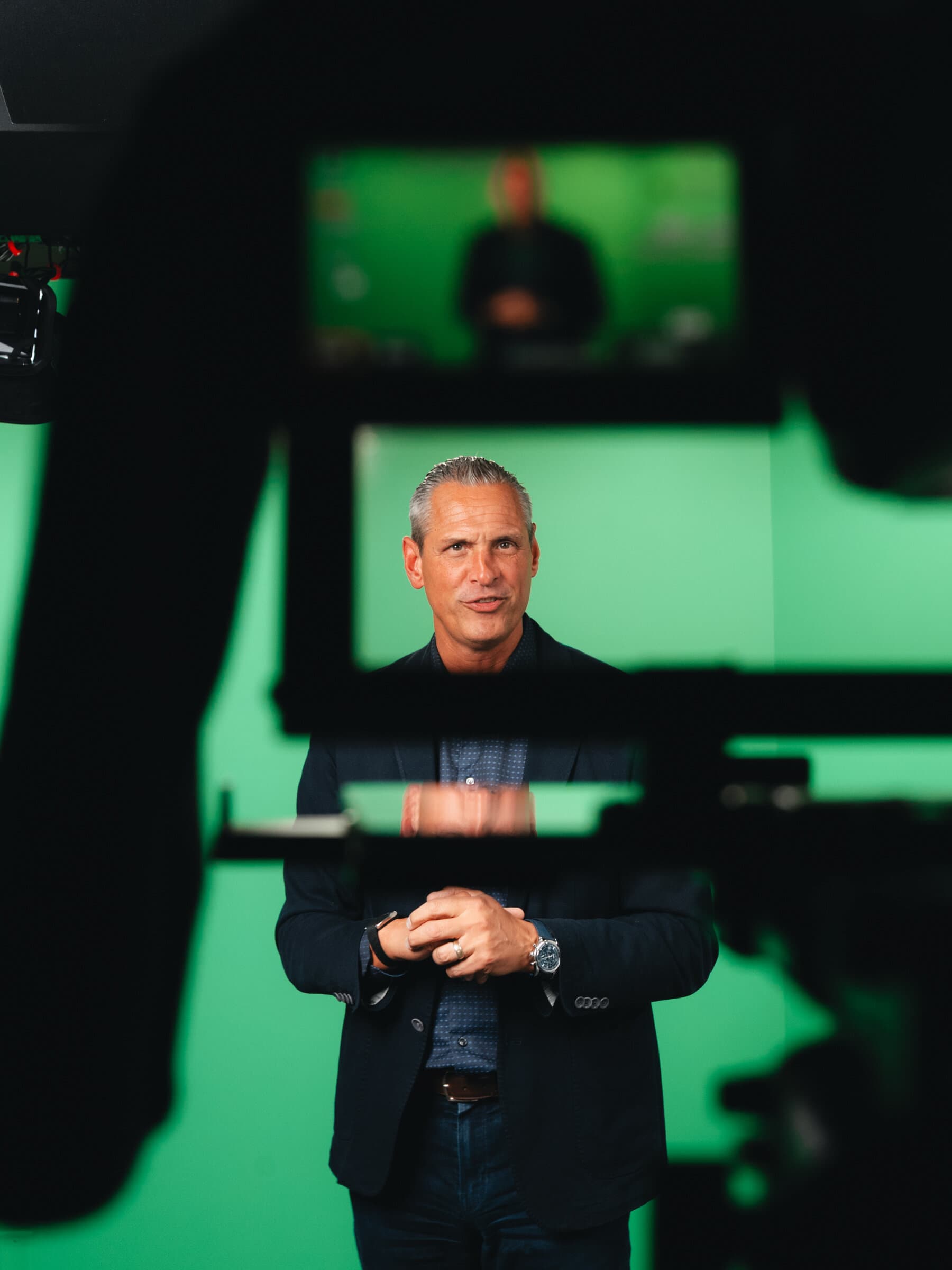 Behind the scenes — Nathan Unruh framed through the camera monitor in the studio