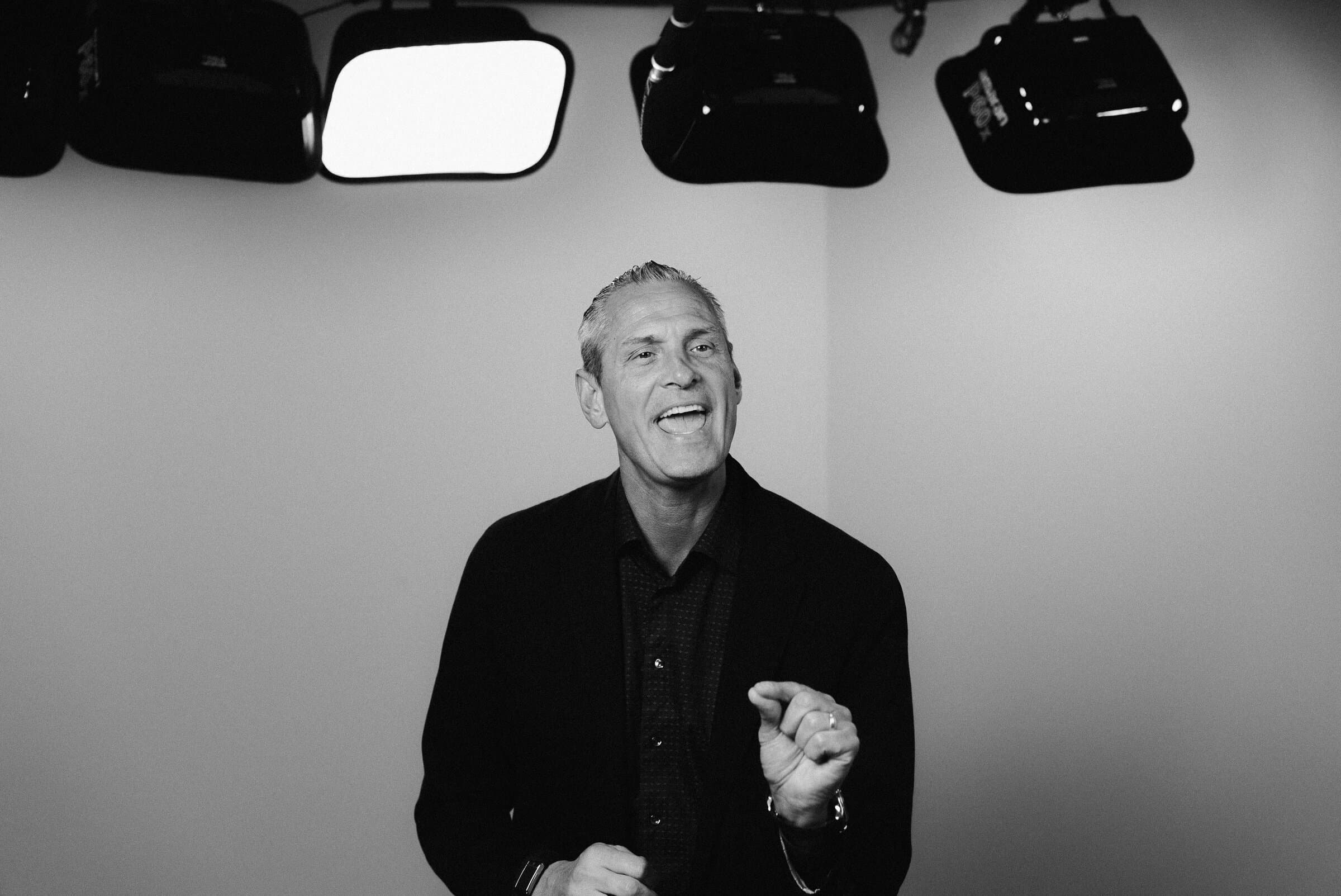 Black-and-white portrait of Nathan Unruh on set between takes